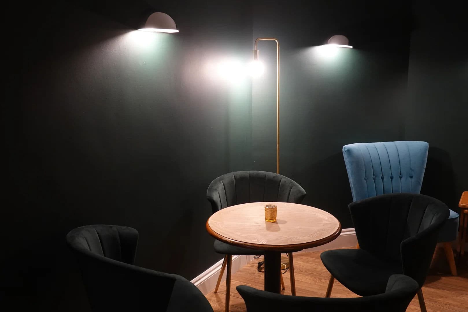 Cosy seating area with round table and ambient lighting