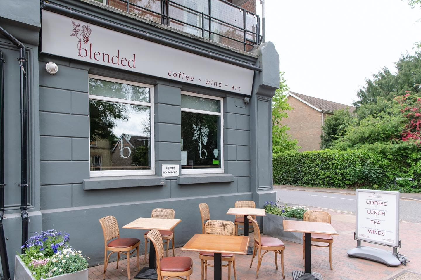 The exterior of Blended on London Road, Southborough, with the coffee, wine and art sign and pavement tables